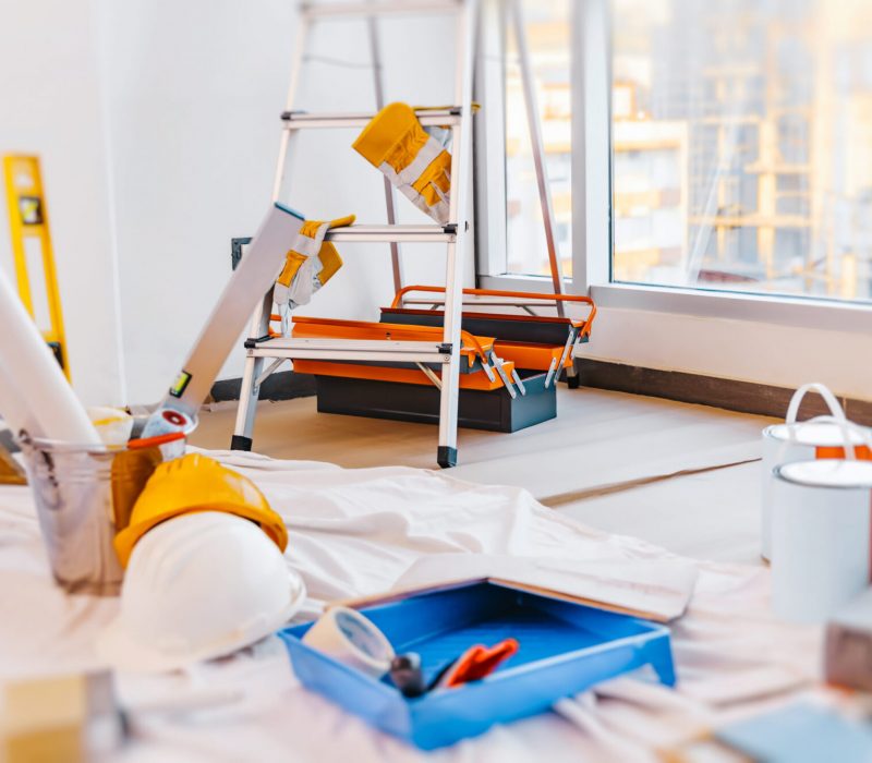 Still Life from Tools for Repair. Brush and Paint for Painting Walls, Ladder and Rulers. Decorative Renovation of a New Apartment.